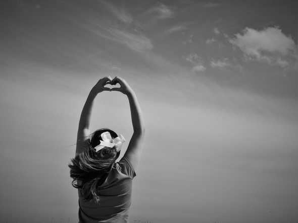 Girl making heart shape with her hands